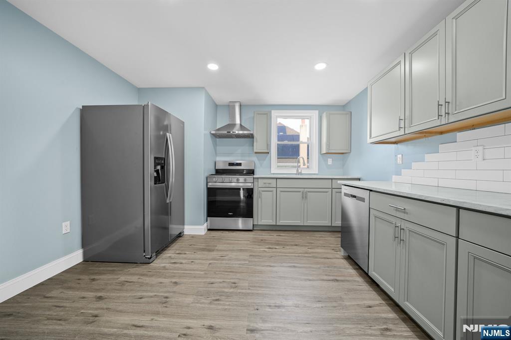 137 Prospect Place Rutherford, NJ 07070 - Photo 6 of 19 a kitchen with stainless steel appliances granite countertop a refrigerator sink and cabinets