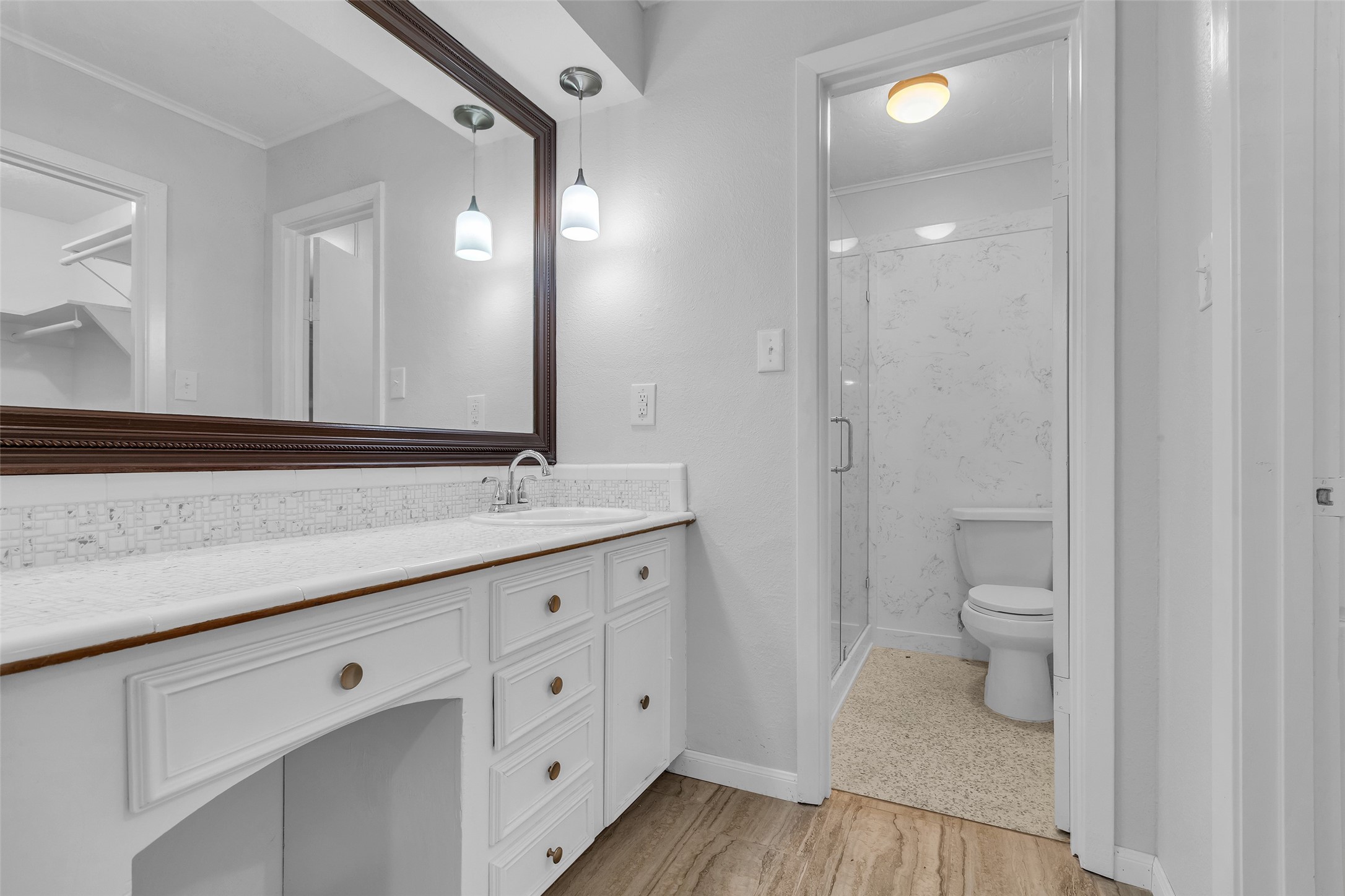 23311 Nichols Sawmill Road Hockley, TX 77447 - Photo 13 of 23 a bathroom with a granite countertop sink toilet and shower