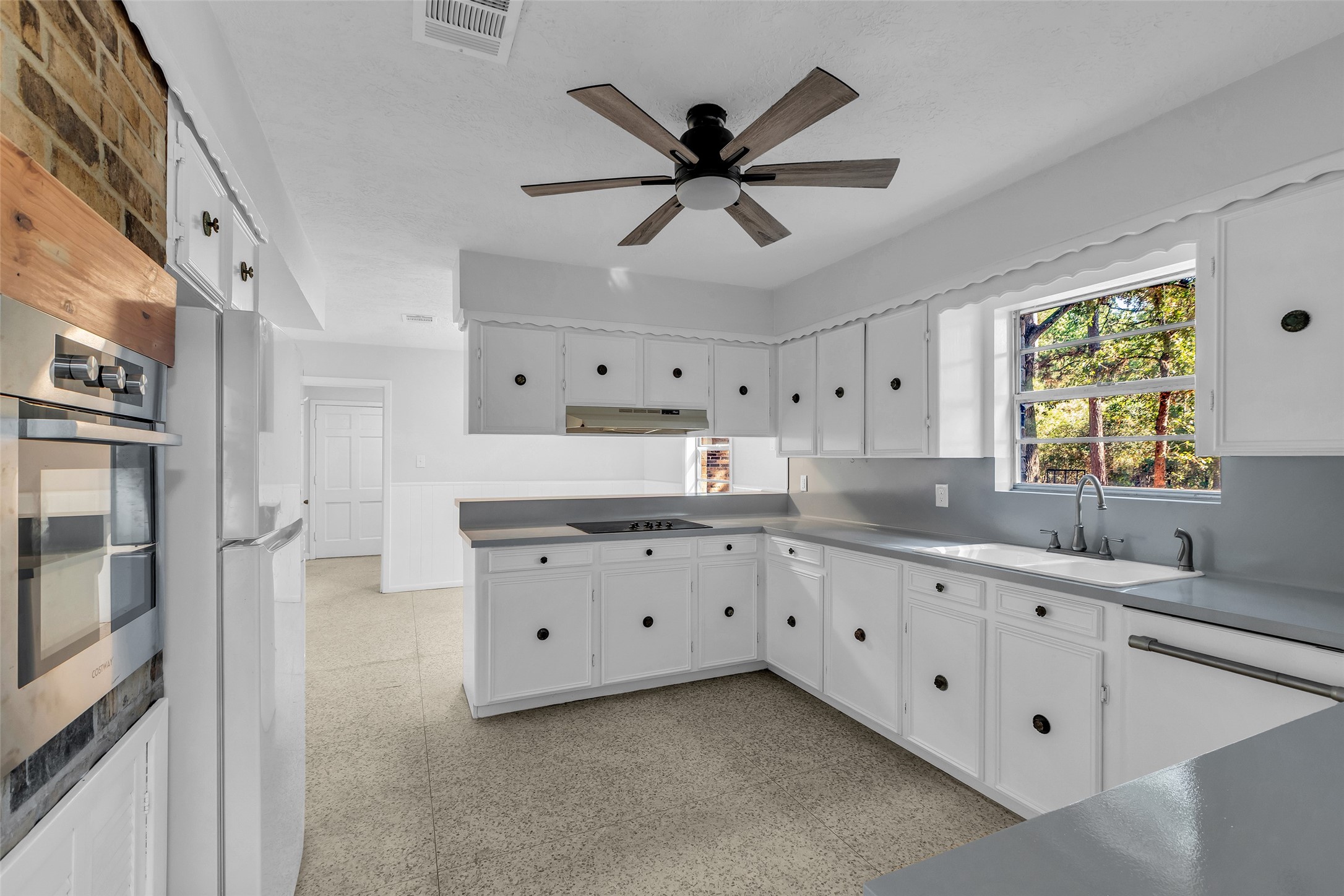 23311 Nichols Sawmill Road Hockley, TX 77447 - Photo 6 of 23 a kitchen with counter top space and window