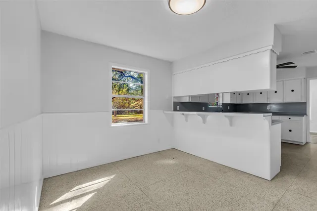 a view of cabinets and window