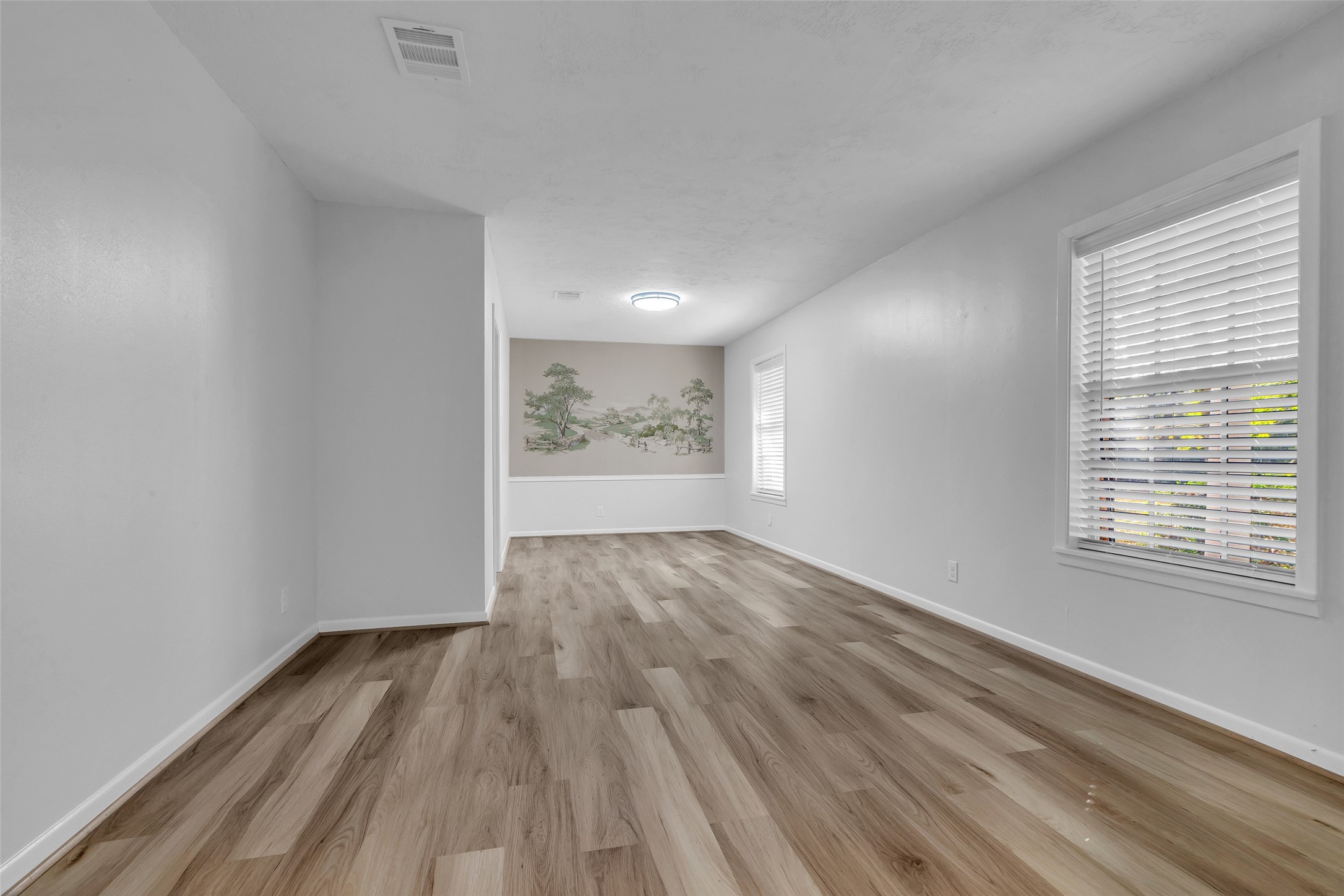 23311 Nichols Sawmill Road Hockley, TX 77447 - Photo 9 of 23 wooden floor in an empty room with a window