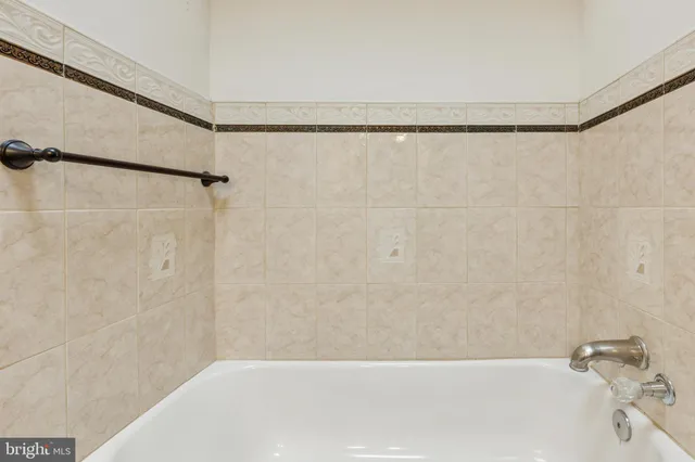 a bathroom with a shower and a bathtub