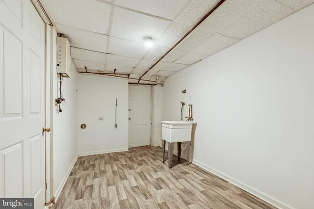 a view of a storage & utility room with wooden floor