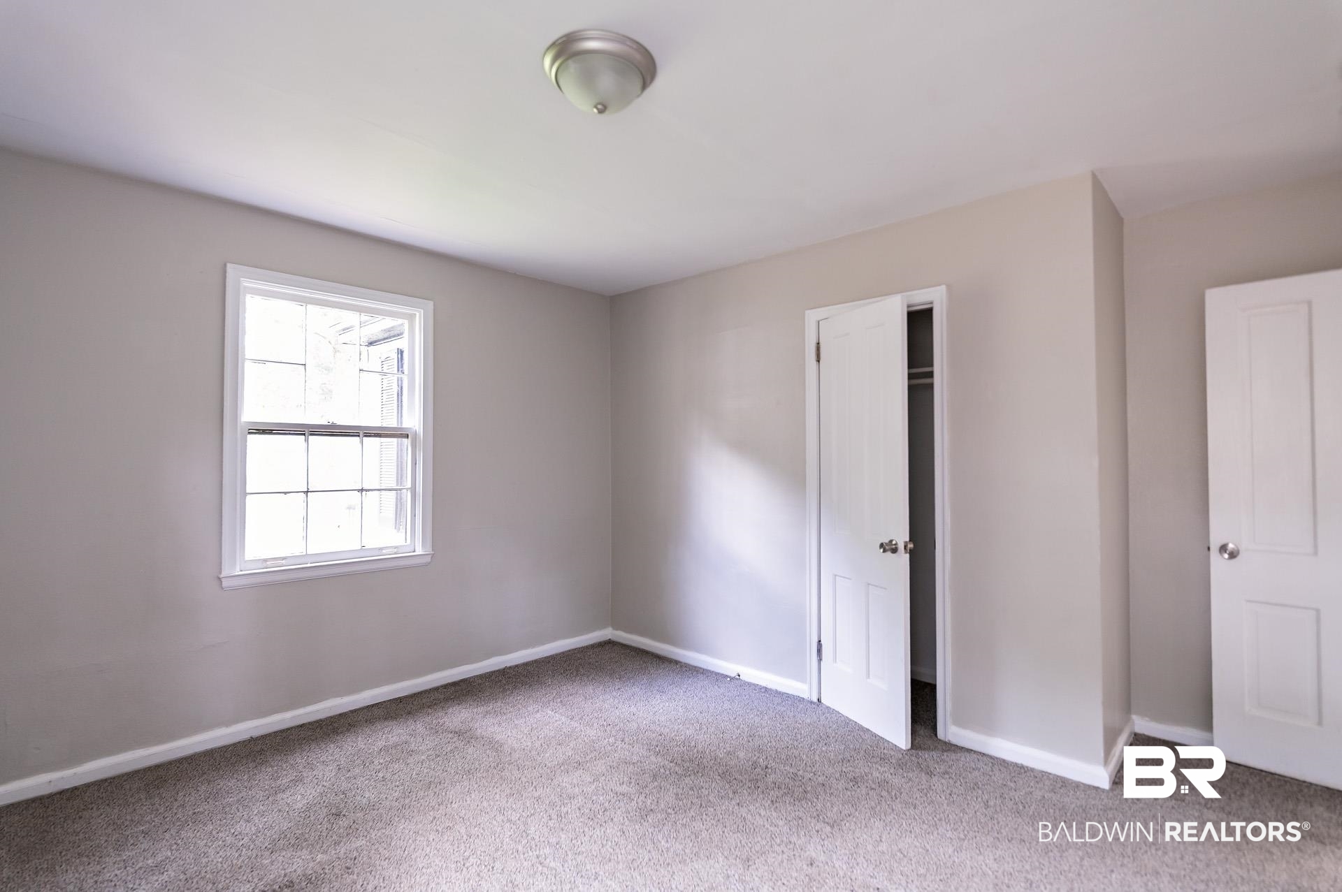 1869 Mott Drive West Mobile, AL 36617 - Photo 18 of 34 Unfurnished bedroom featuring carpet flooring and baseboards