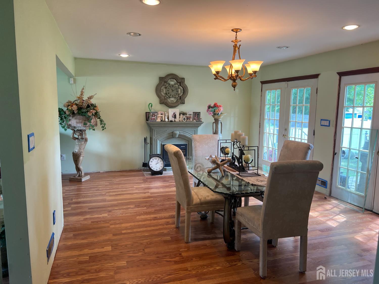 105 Howard Avenue Edison, NJ 08837 - Photo 13 of 39 a view of a dining room with furniture and a chandelier
