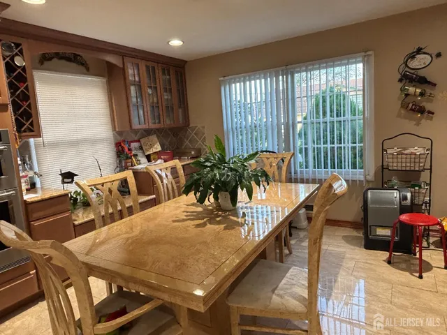 a view of a dining room with furniture window and outside view