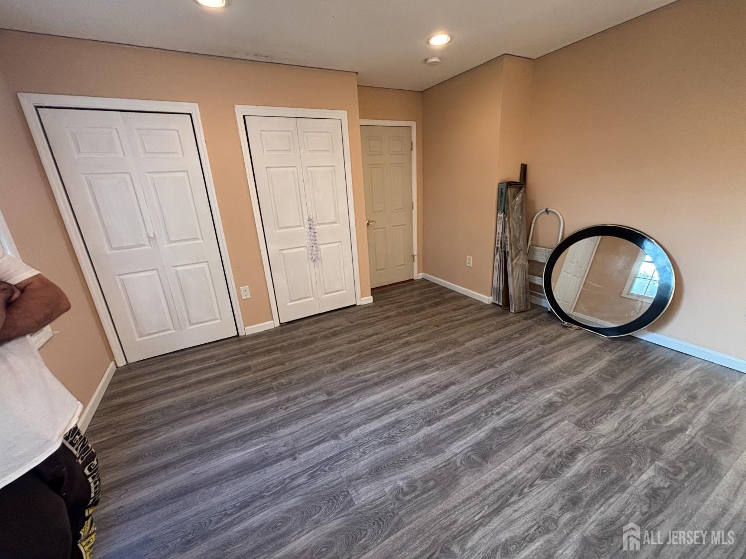 105 Howard Avenue Edison, NJ 08837 - Photo 23 of 39 a view of a room with wooden floor