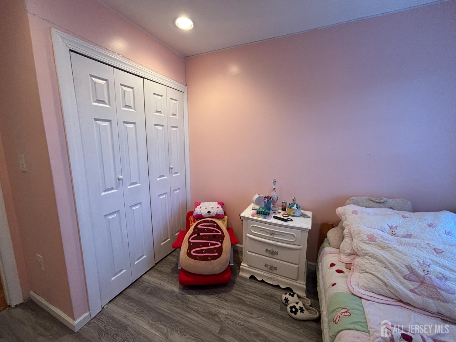 105 Howard Avenue Edison, NJ 08837 - Photo 25 of 39 a bedroom with a bed and a dresser