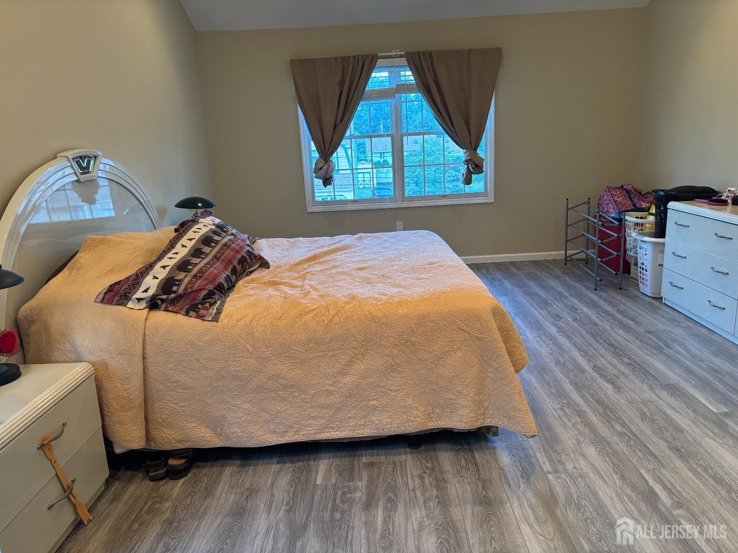 105 Howard Avenue Edison, NJ 08837 - Photo 31 of 39 a bed sitting in a bedroom next to a window