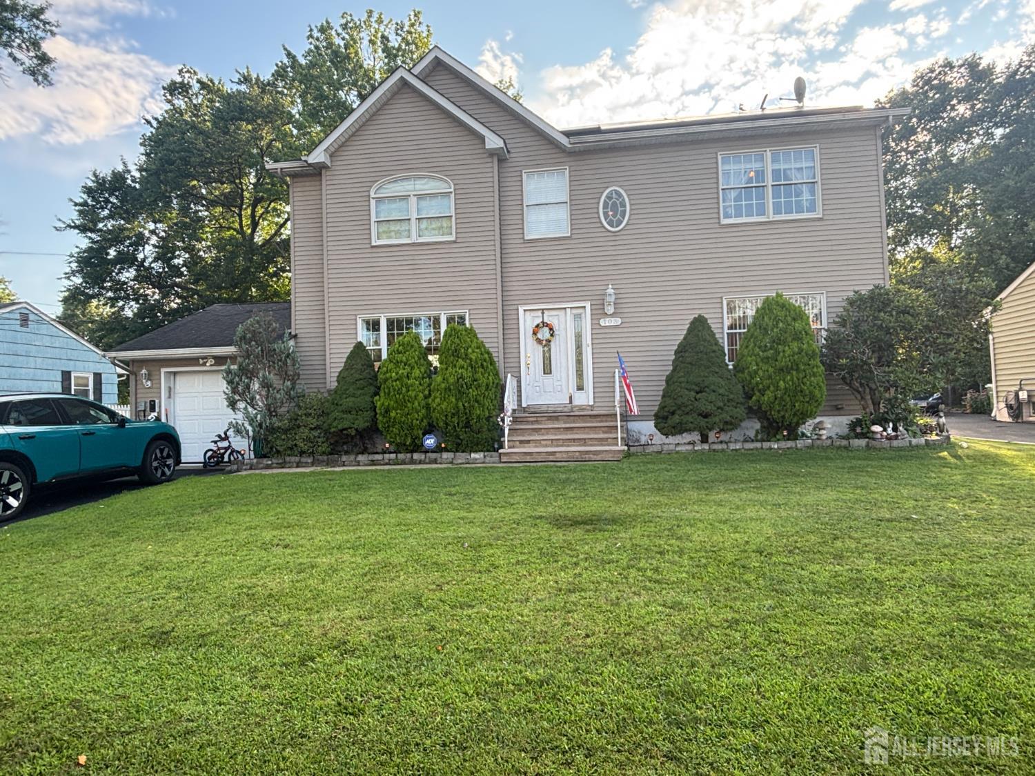 105 Howard Avenue Edison, NJ 08837 - Photo 4 of 39 a front view of house with yard and green space