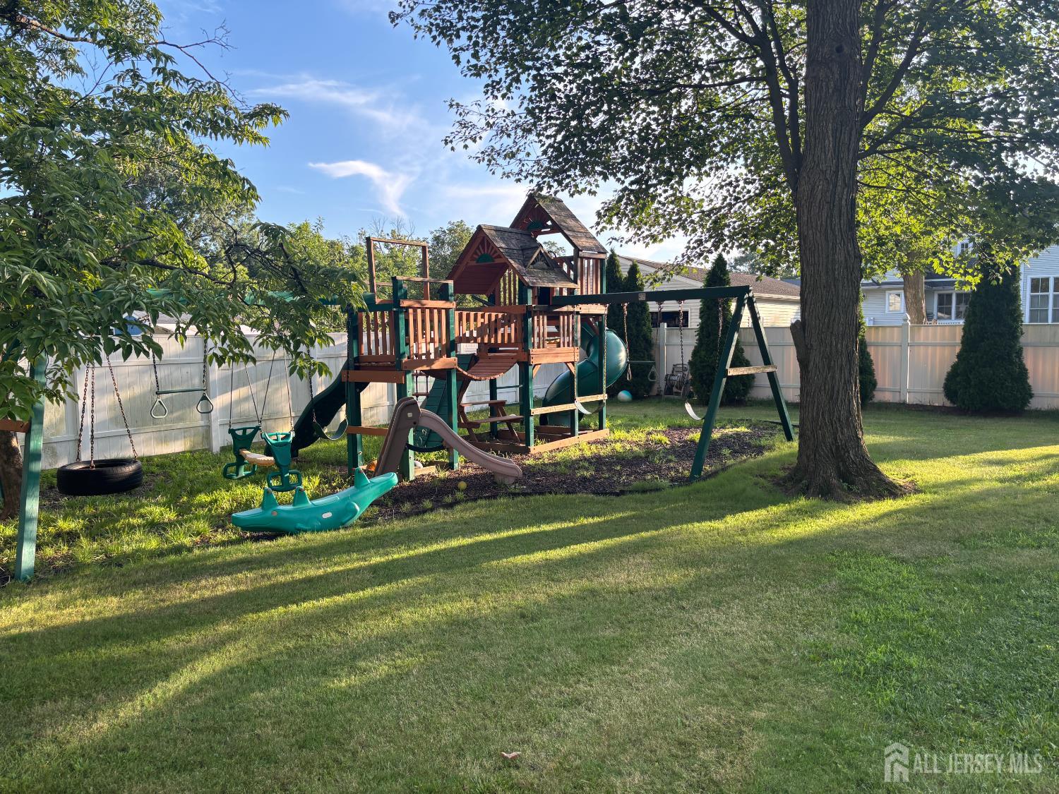 105 Howard Avenue Edison, NJ 08837 - Photo 9 of 39 a view of a park with large trees
