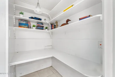 a view of storage and utility room with washer and dryer