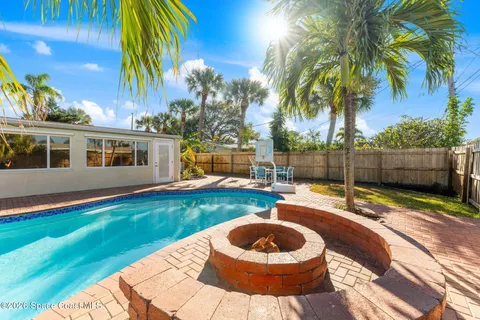 a house view with a backyard space
