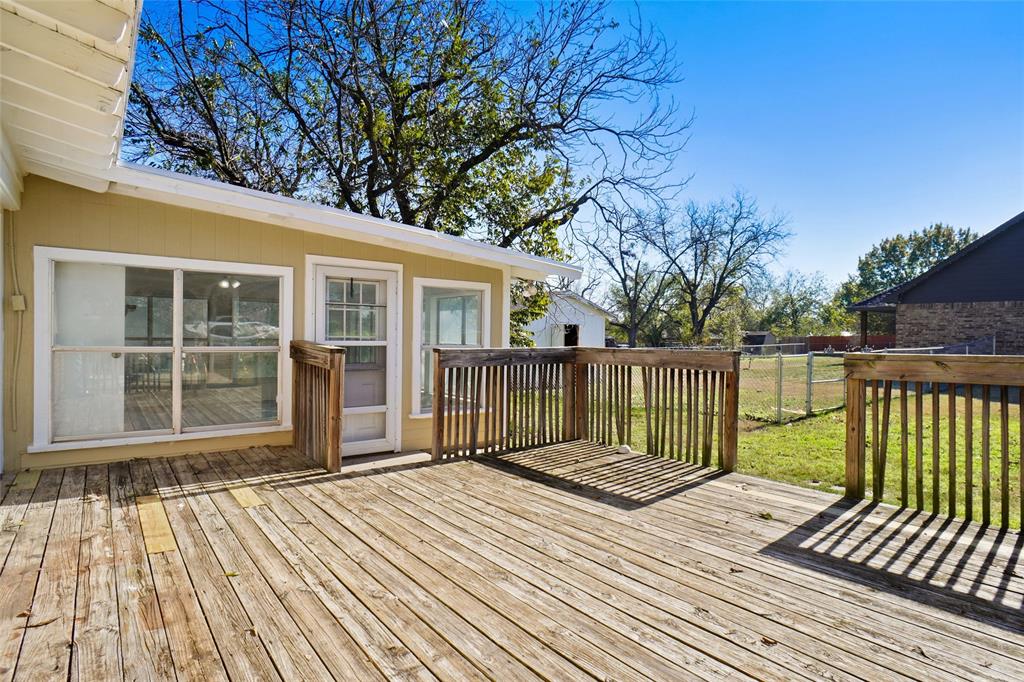 221 West 5th Street Springtown, TX 76082 - Photo 19 of 20 a view of a wooden deck