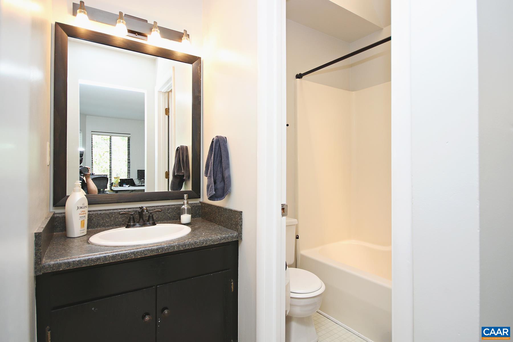 1225 Chatham Ridge Charlottesville, VA 22901 - Photo 16 of 16 a bathroom with a sink a toilet and a mirror