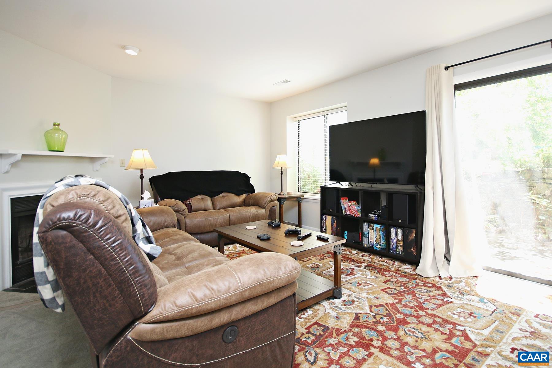 1225 Chatham Ridge Charlottesville, VA 22901 - Photo 3 of 16 a living room with furniture and a flat screen tv