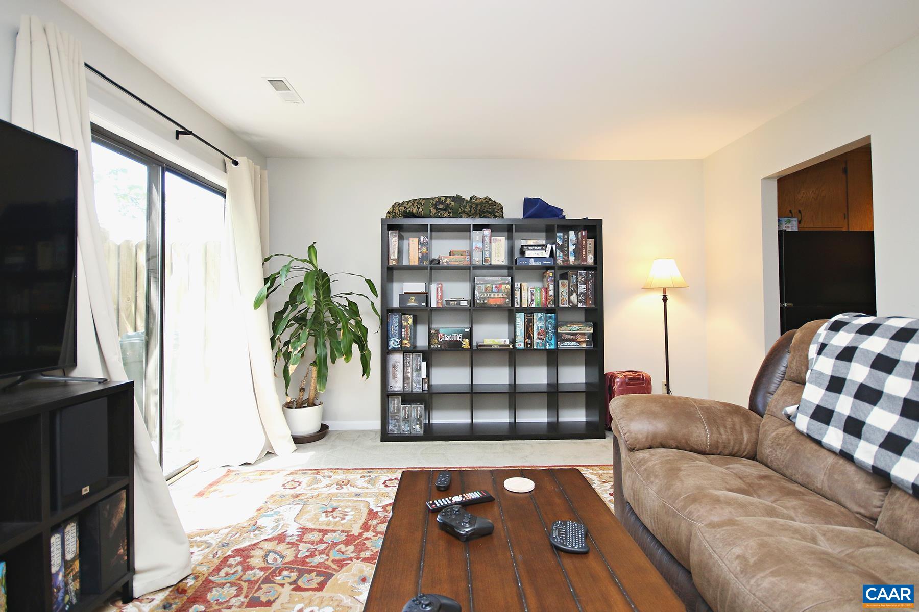 1225 Chatham Ridge Charlottesville, VA 22901 - Photo 5 of 16 a living room with furniture and a flat screen tv