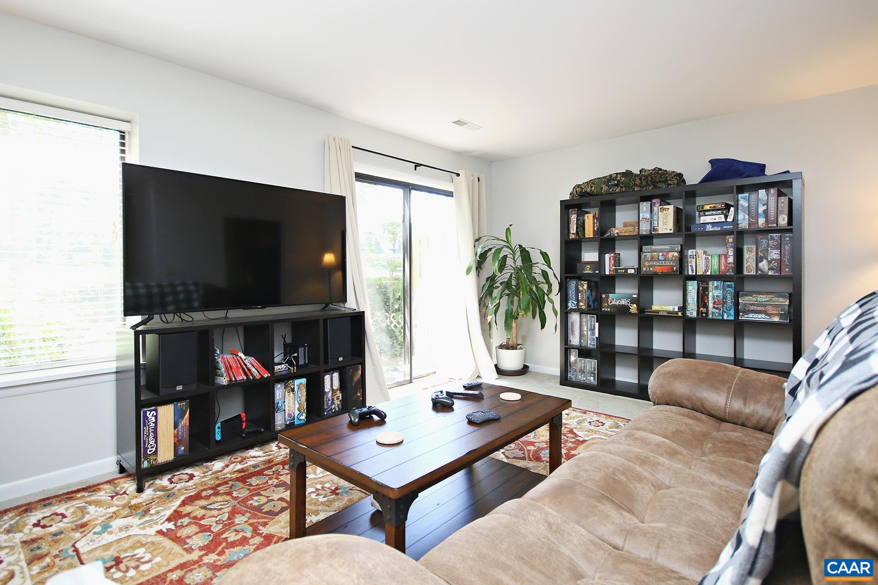 1225 Chatham Ridge Charlottesville, VA 22901 - Photo 6 of 16 a living room with furniture and a flat screen tv