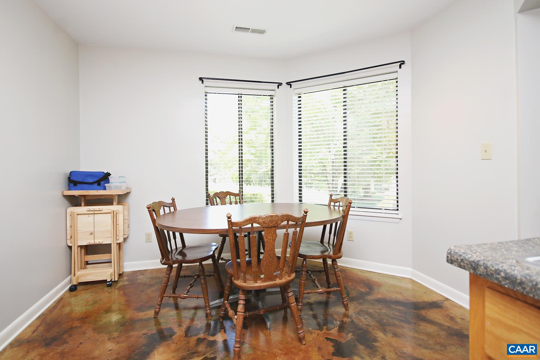 1225 Chatham Ridge Charlottesville, VA 22901 - Photo 8 of 16 a view of a dining room with furniture and wooden floor