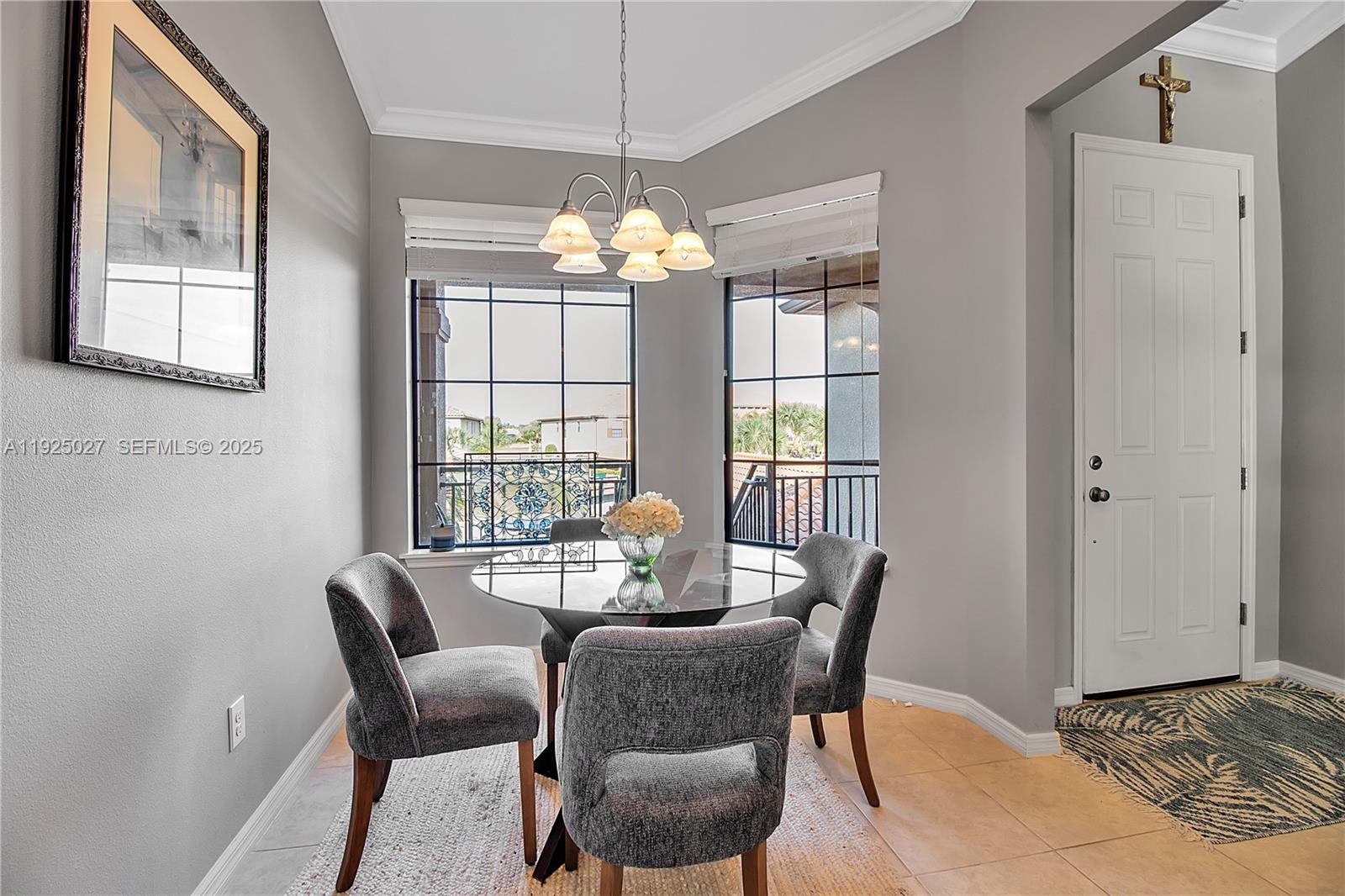 13608 Messina Loop, Unit 201 Bradenton, FL 34211 - Photo 13 of 68 a dining room with furniture a livingroom and chandelier