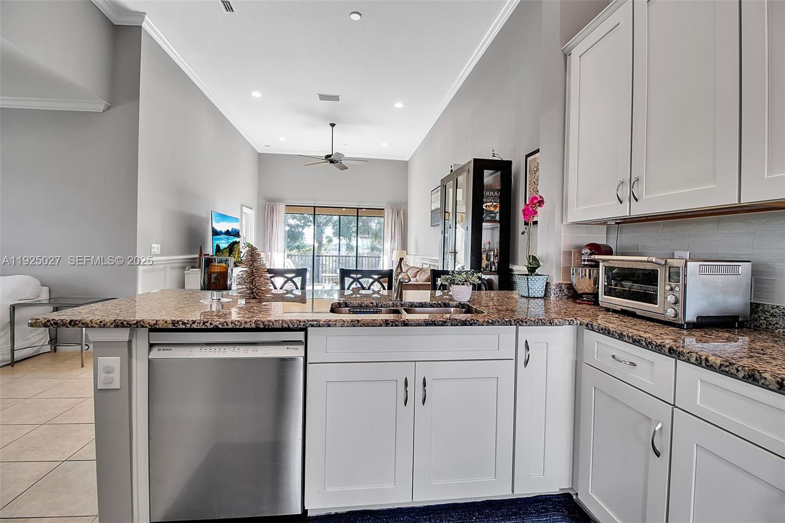 13608 Messina Loop, Unit 201 Bradenton, FL 34211 - Photo 16 of 68 a kitchen with granite countertop a sink and cabinets