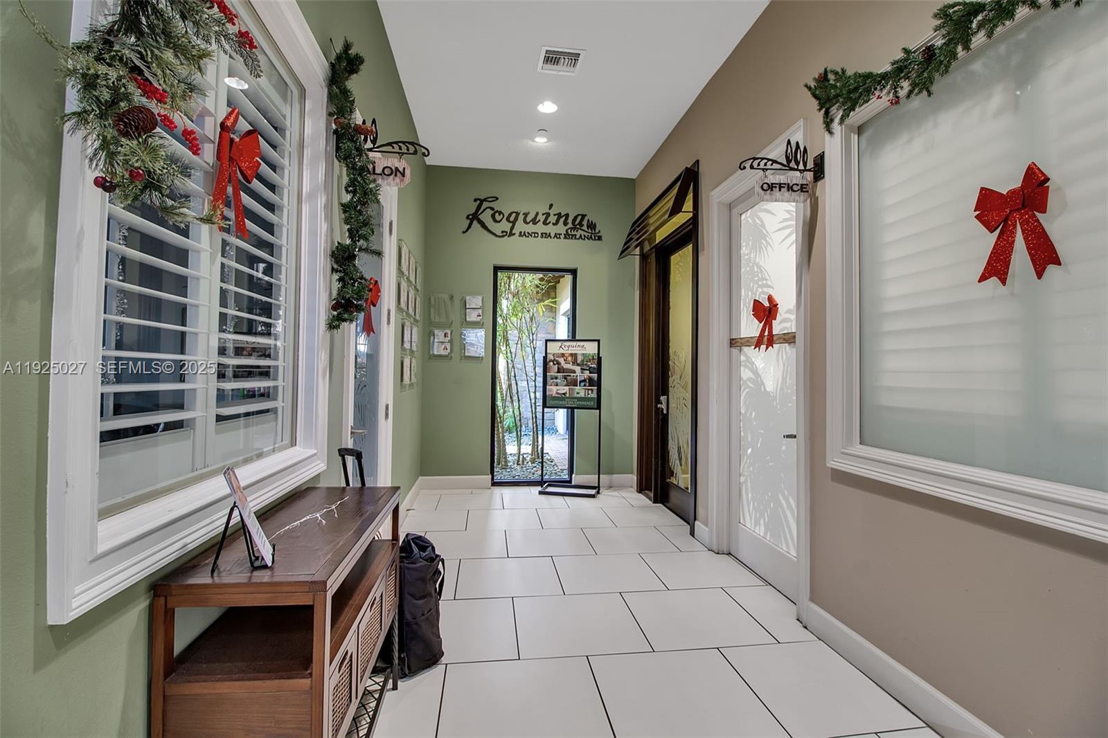 13608 Messina Loop, Unit 201 Bradenton, FL 34211 - Photo 51 of 68 a view of hallway with a flower pot and a bookshelf