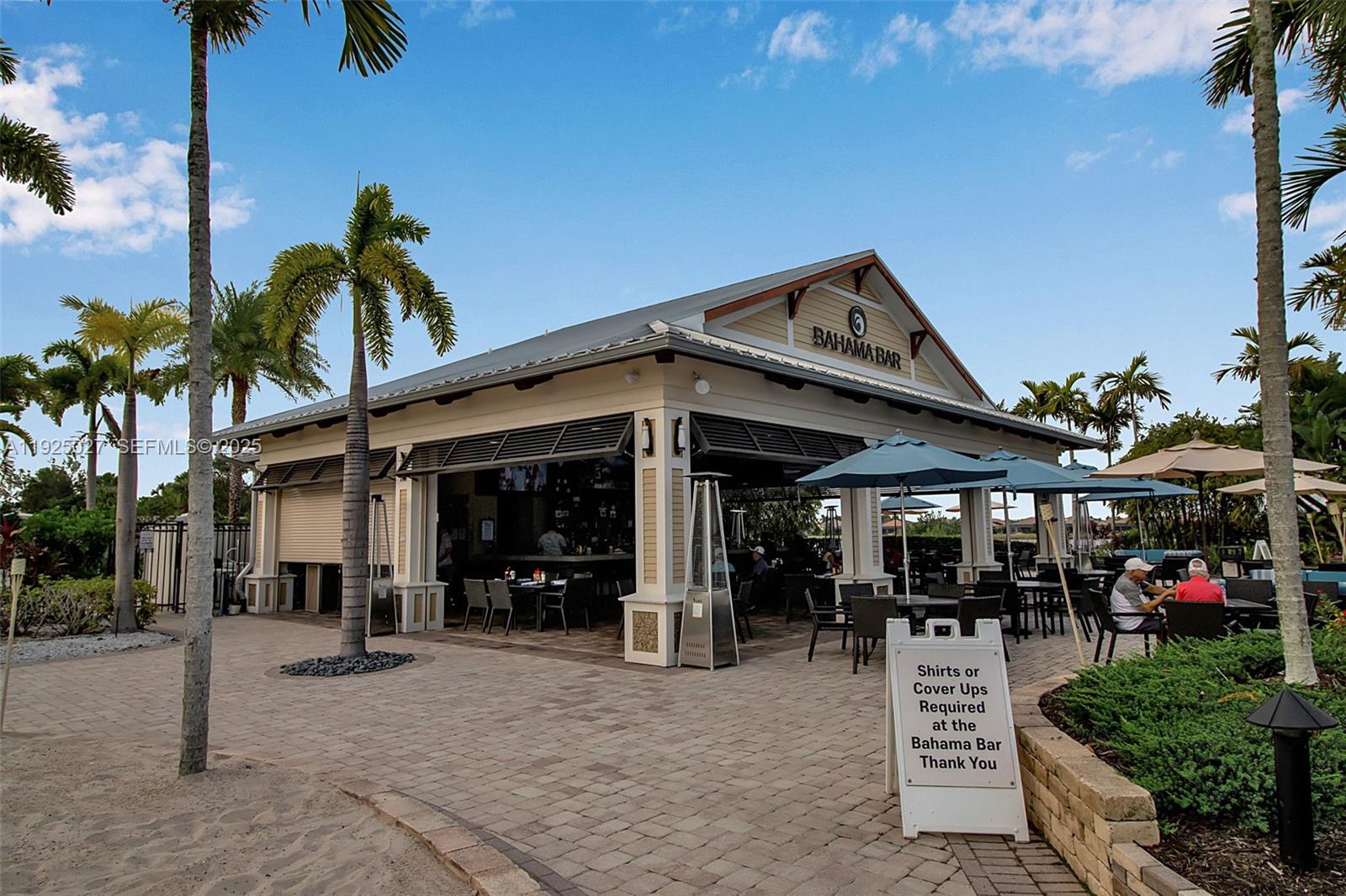13608 Messina Loop, Unit 201 Bradenton, FL 34211 - Photo 52 of 68 a view of a chairs and tables in patio