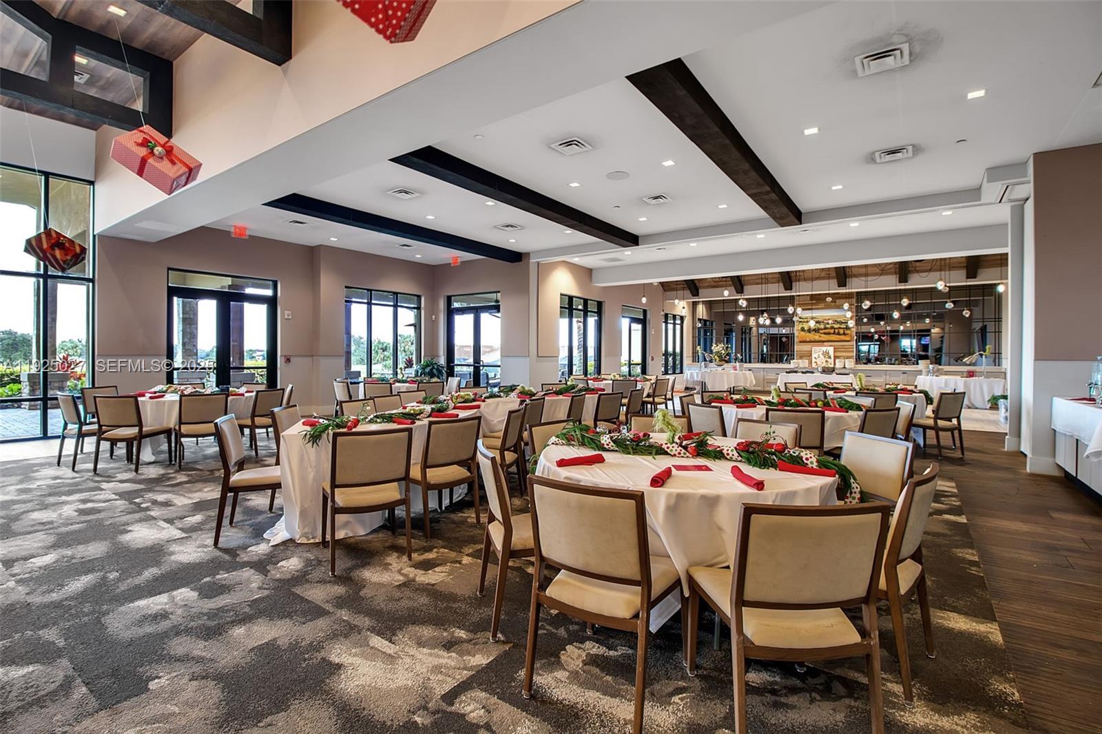 13608 Messina Loop, Unit 201 Bradenton, FL 34211 - Photo 56 of 68 a dining room with lots of tables and chairs
