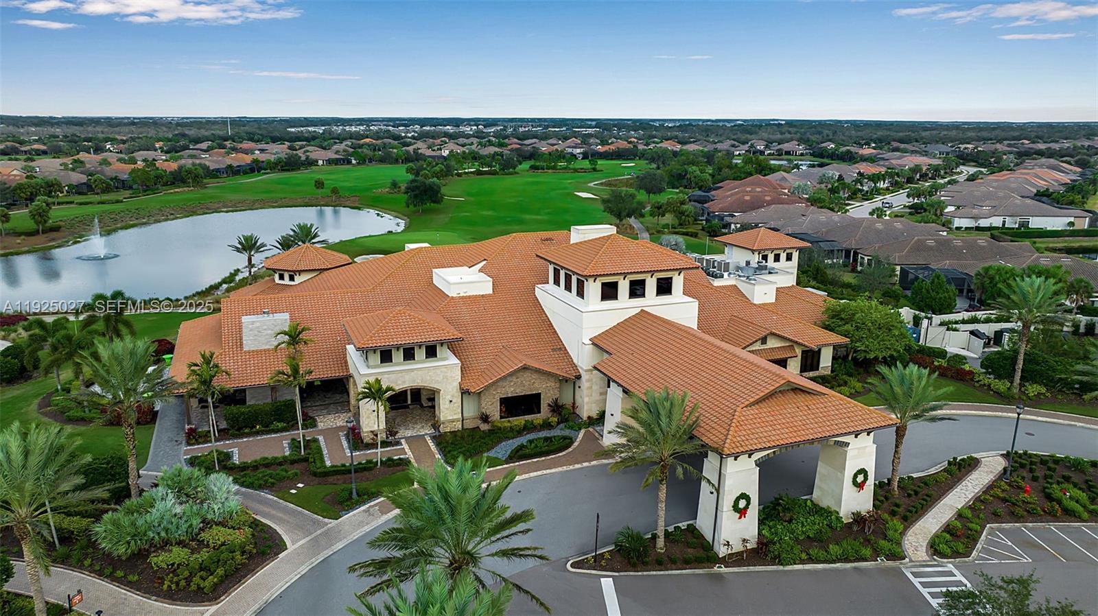 13608 Messina Loop, Unit 201 Bradenton, FL 34211 - Photo 68 of 68 an aerial view of multiple houses with yard