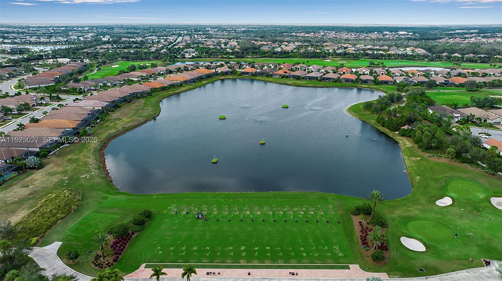 13608 Messina Loop, Unit 201 Bradenton, FL 34211 - Photo 7 of 68 an aerial view of a golf course with a lake view