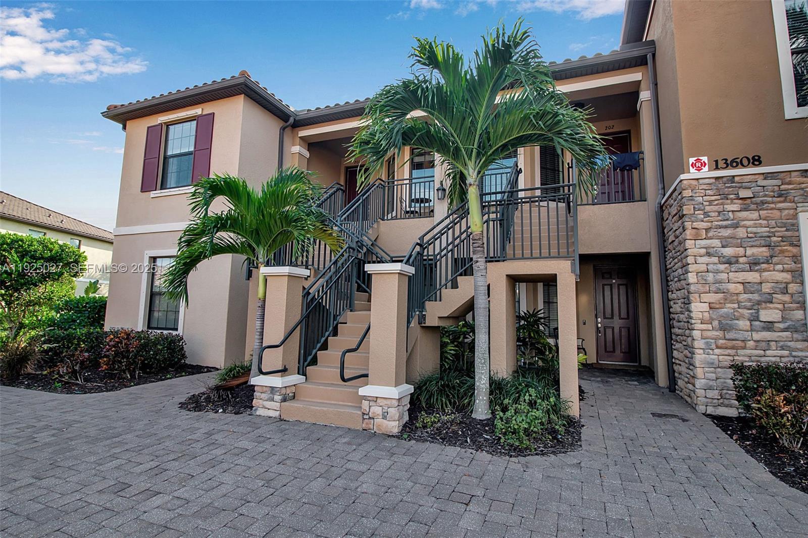 13608 Messina Loop, Unit 201 Bradenton, FL 34211 - Photo 10 of 68 a front view of a house with garden