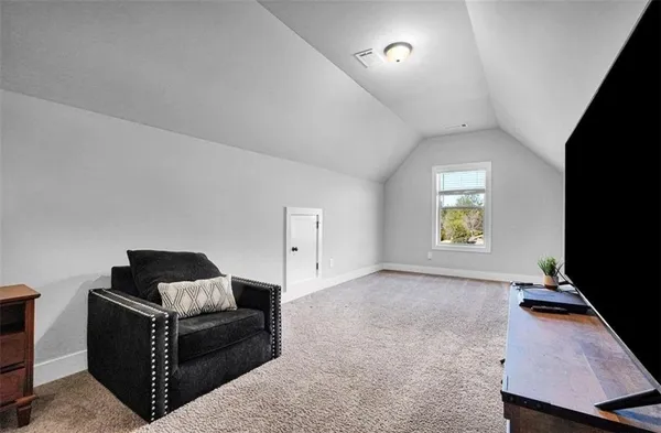 a bedroom with a bed and a window in it
