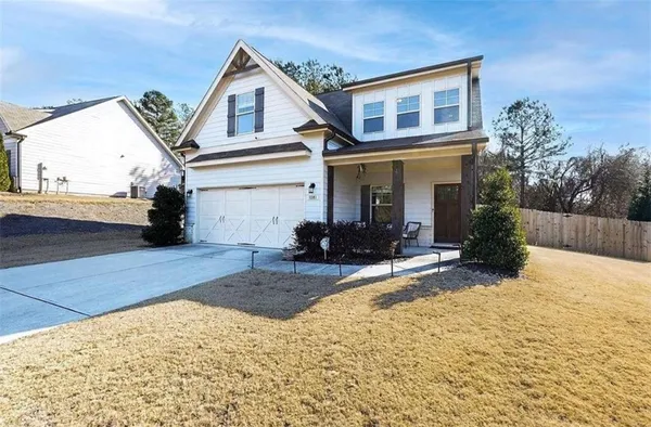 a view of a house with a snow in the background