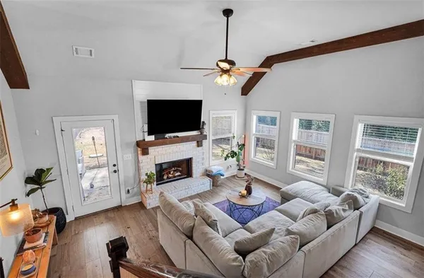 a living room with furniture and a fireplace