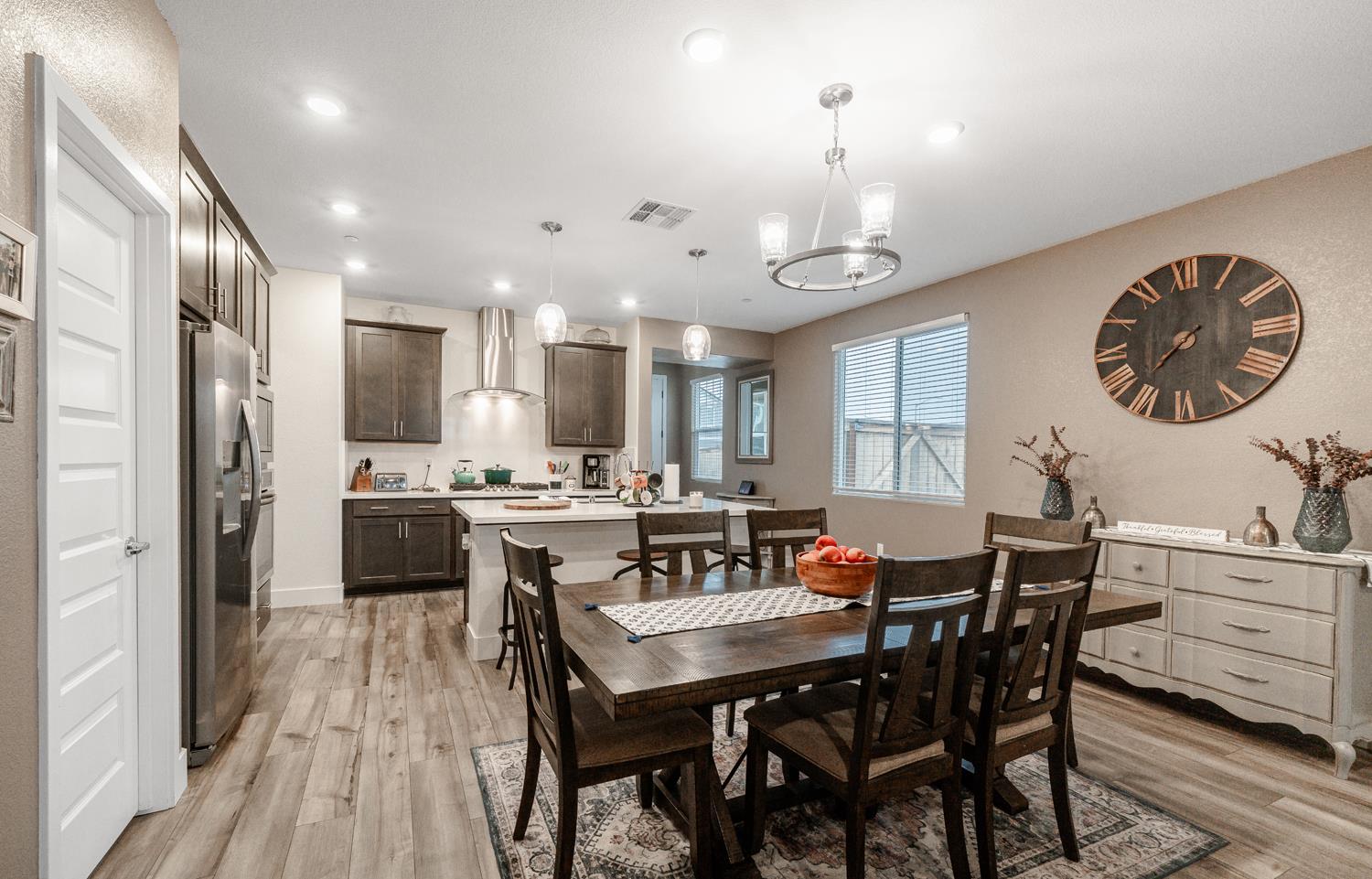 4414 Hawkfinch Circle Rancho Cordova, CA 95742 - Photo 14 of 40 a large kitchen with a table and chairs