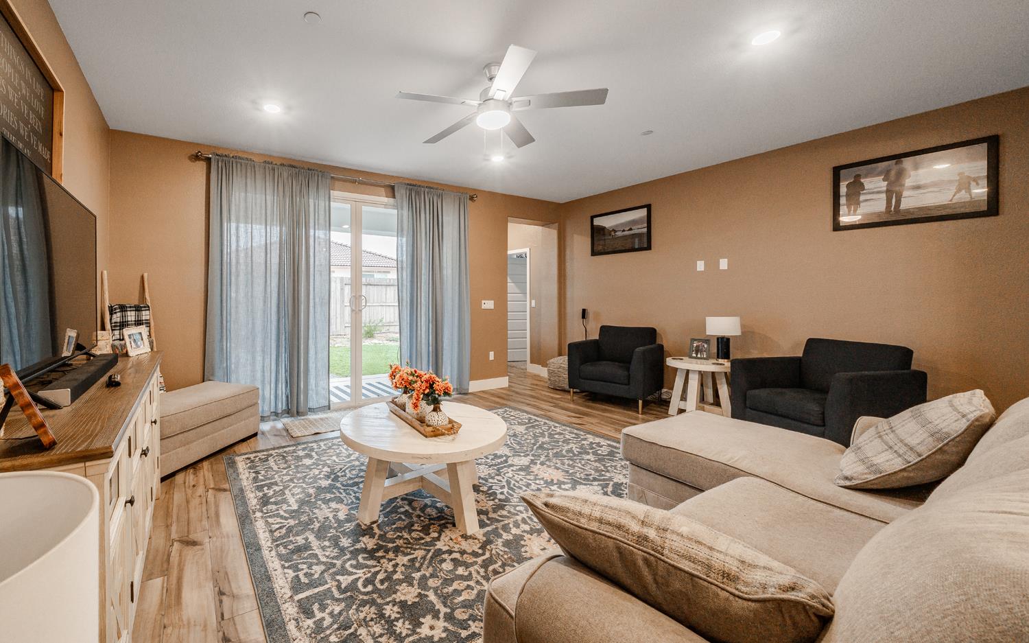 4414 Hawkfinch Circle Rancho Cordova, CA 95742 - Photo 16 of 40 a living room with furniture and large windows