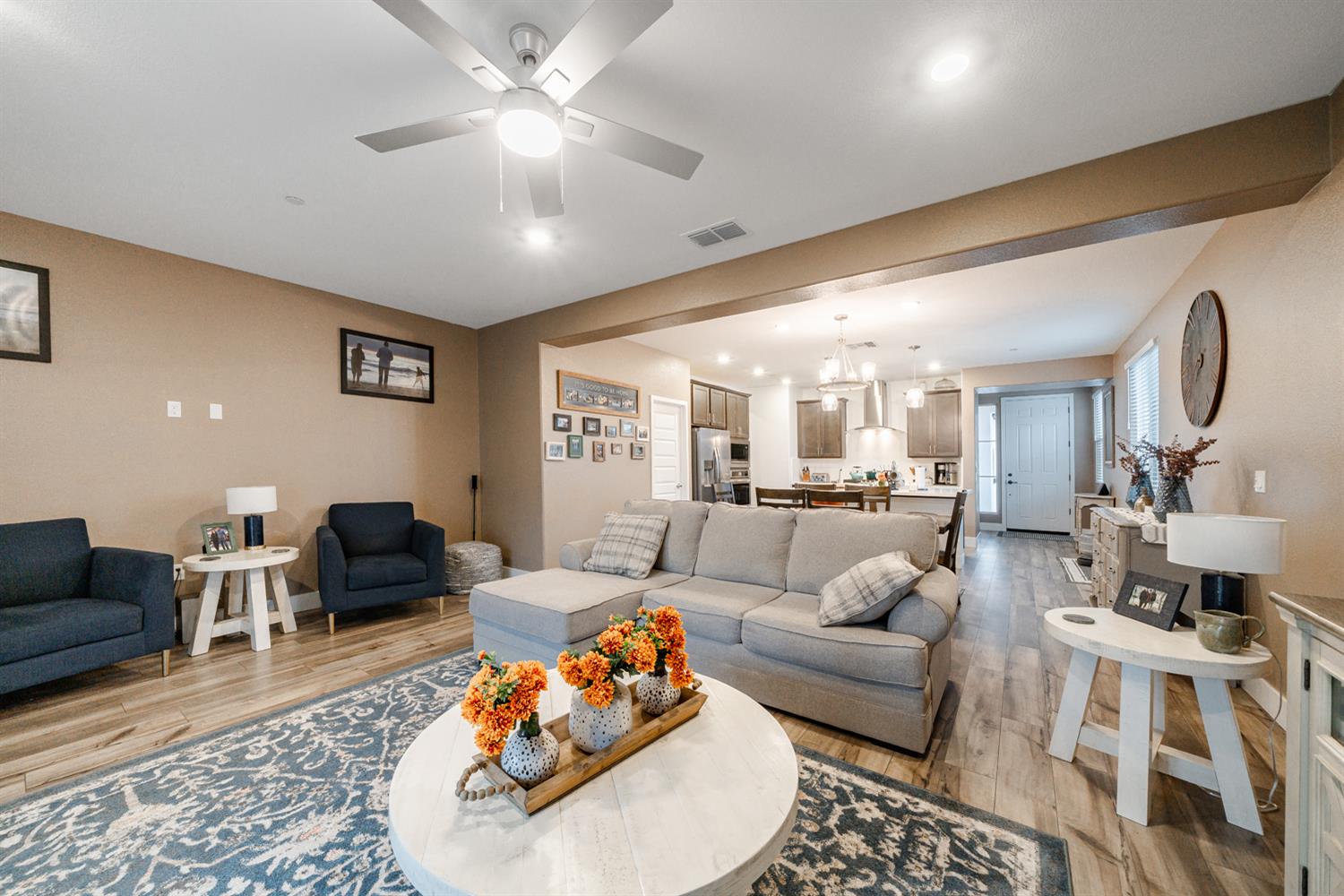 4414 Hawkfinch Circle Rancho Cordova, CA 95742 - Photo 18 of 40 a living room with furniture a rug and a chandelier