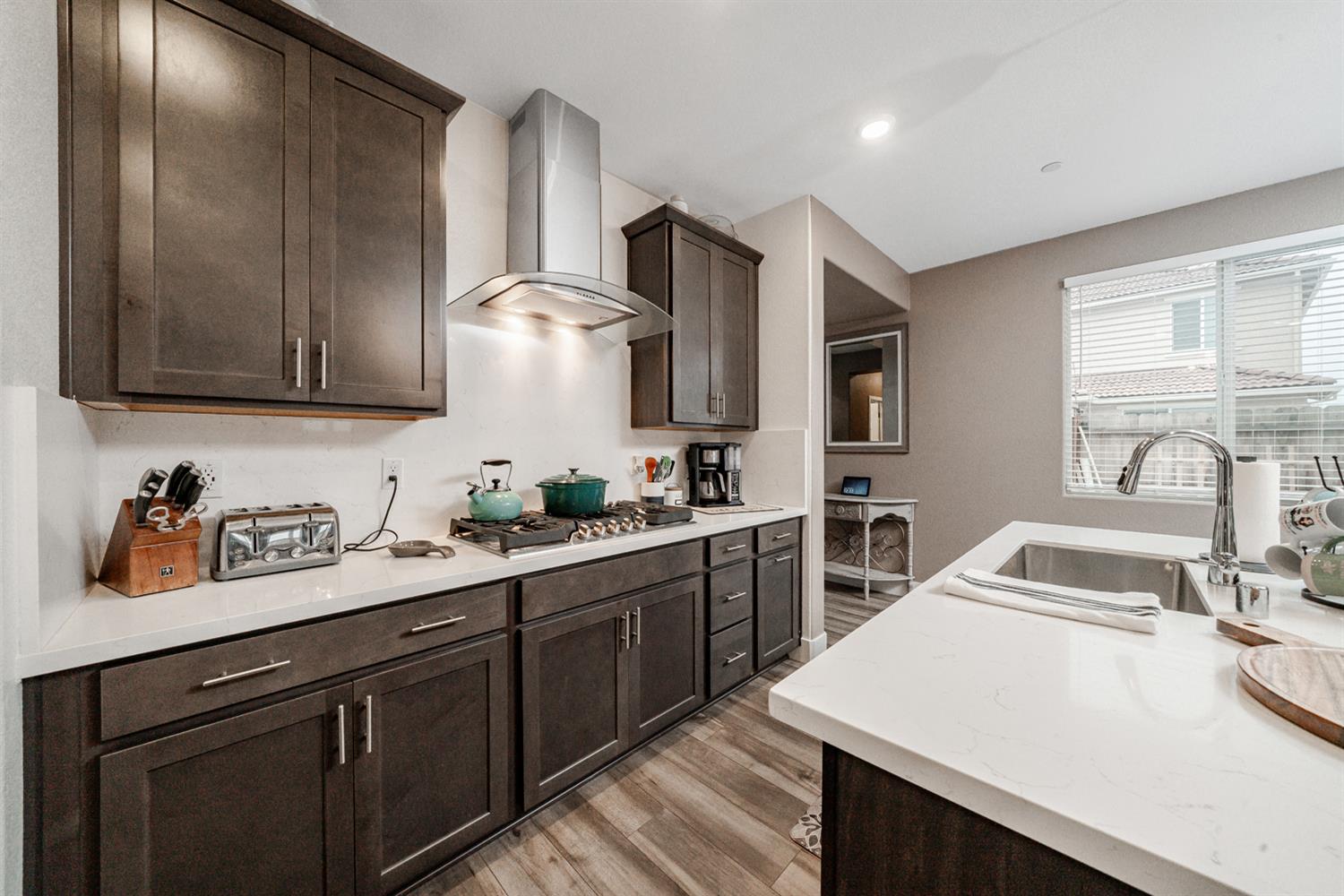 4414 Hawkfinch Circle Rancho Cordova, CA 95742 - Photo 20 of 40 a kitchen with a sink stove and cabinets