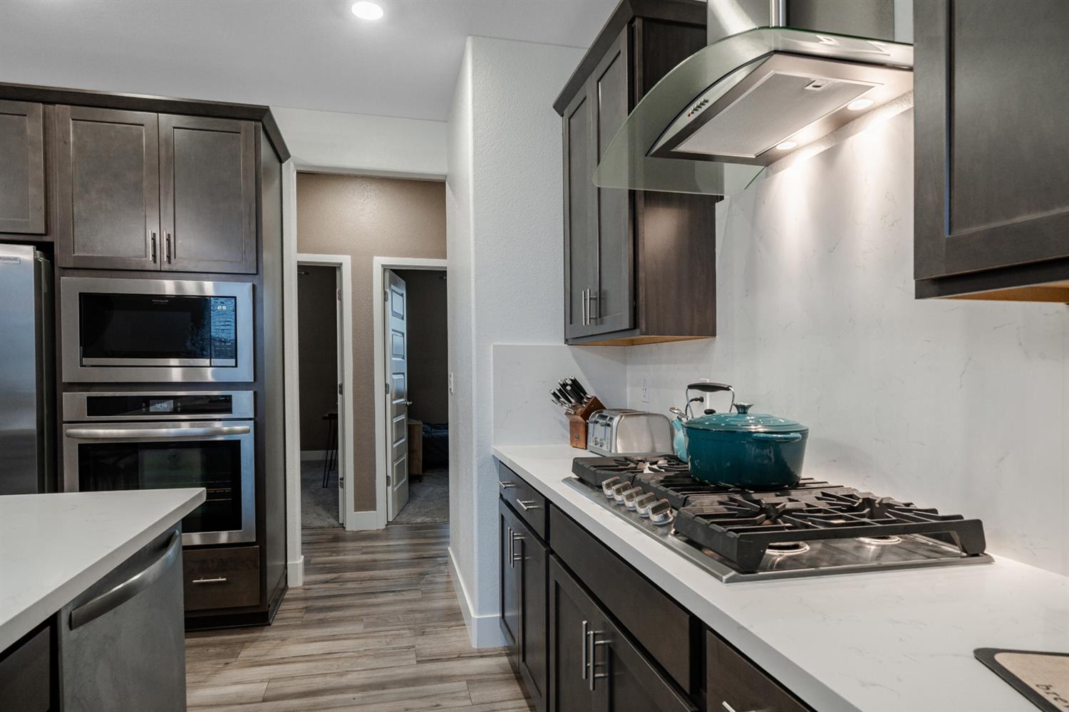 4414 Hawkfinch Circle Rancho Cordova, CA 95742 - Photo 22 of 40 a kitchen with a stove and a refrigerator
