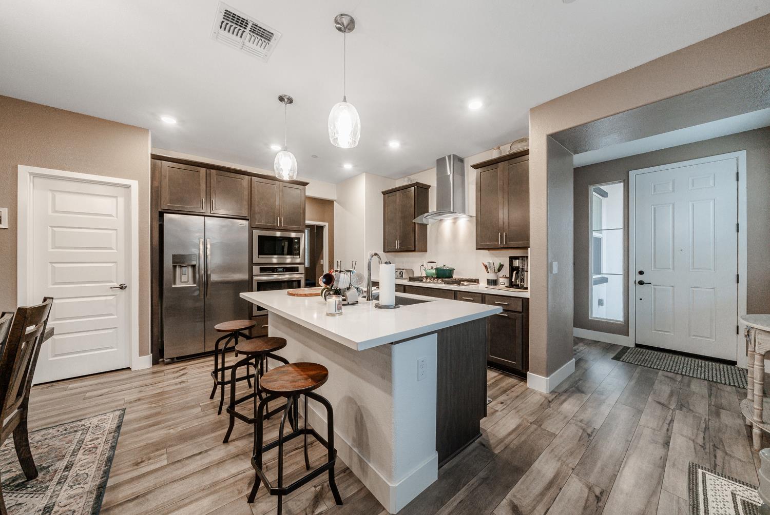4414 Hawkfinch Circle Rancho Cordova, CA 95742 - Photo 10 of 40 a kitchen with a sink a counter space stainless steel appliances and cabinets