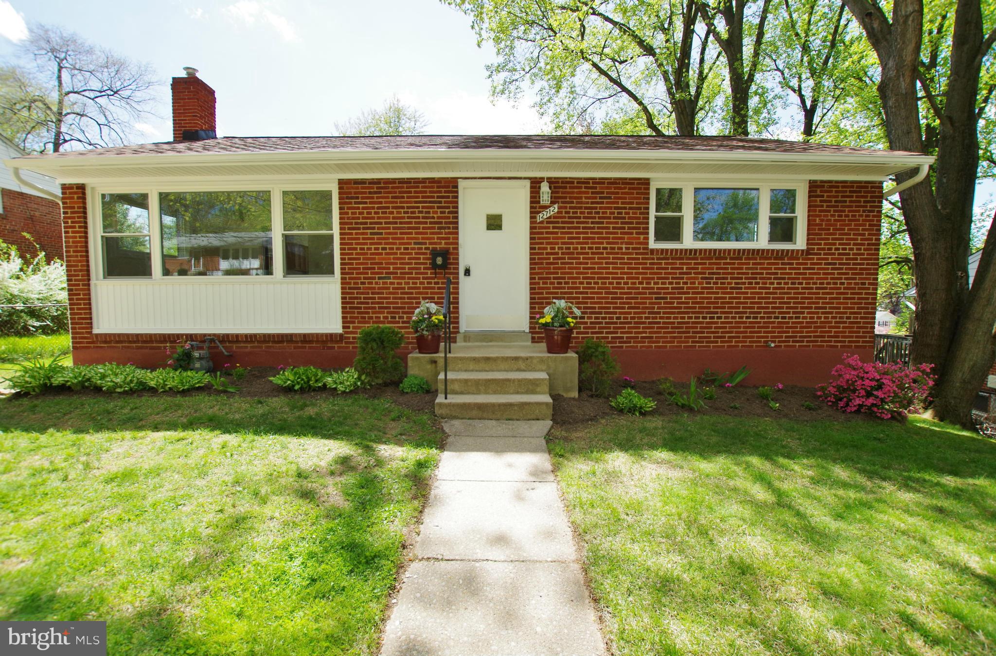 12712 Helen Road Silver Spring, MD 20906 - Photo 1 of 30 a front view of a house with garden