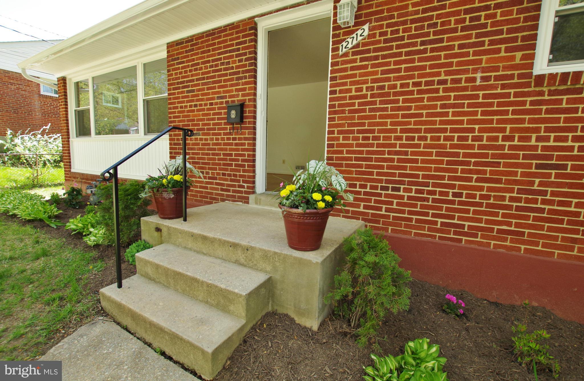 12712 Helen Road Silver Spring, MD 20906 - Photo 5 of 30 a view of a house with a yard and sitting area