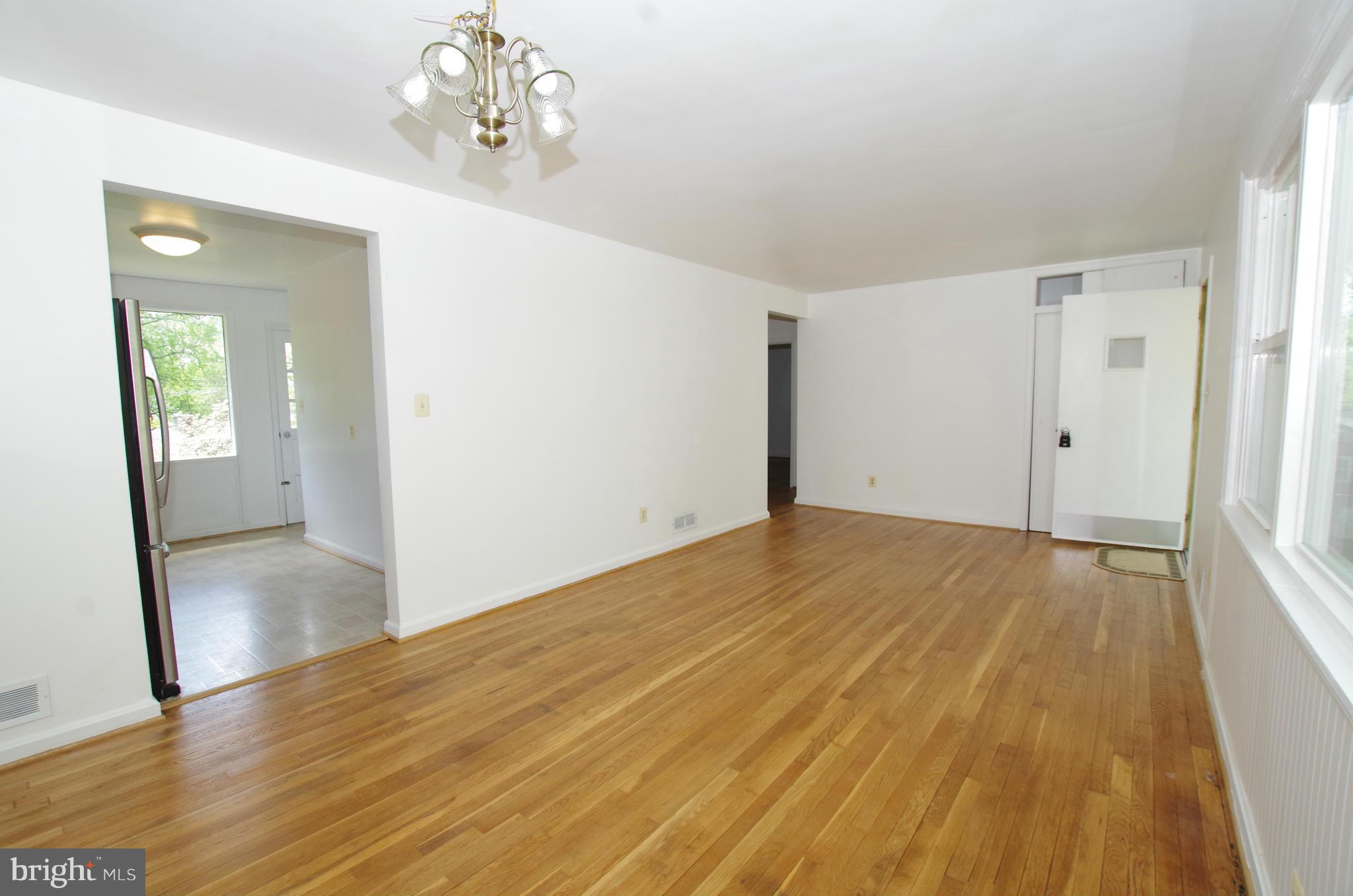 12712 Helen Road Silver Spring, MD 20906 - Photo 7 of 30 a view of empty room with wooden floor