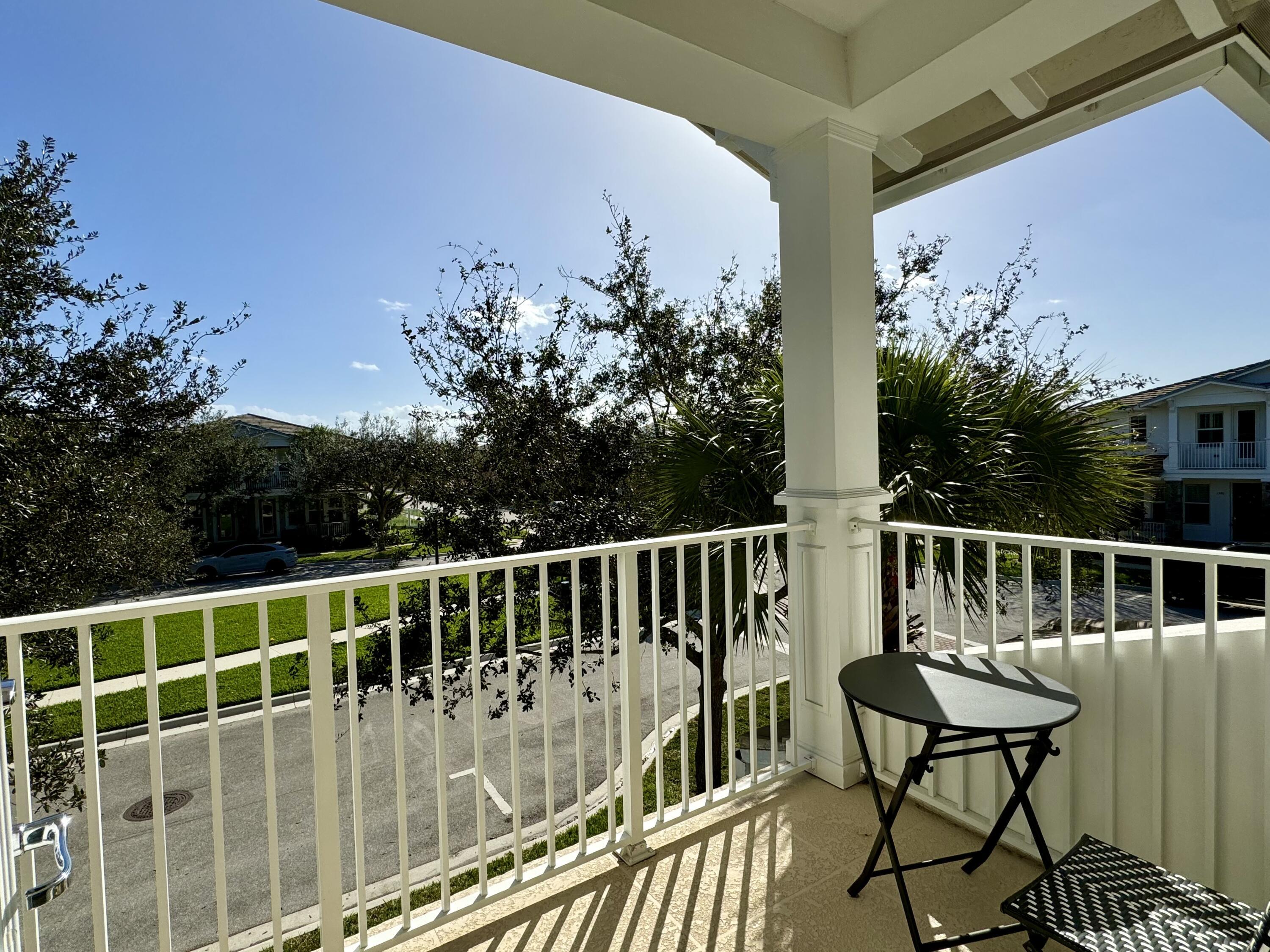 2758 Avalon Way Jupiter, FL 33458 - Photo 24 of 51 a view of a chair and table in the balcony