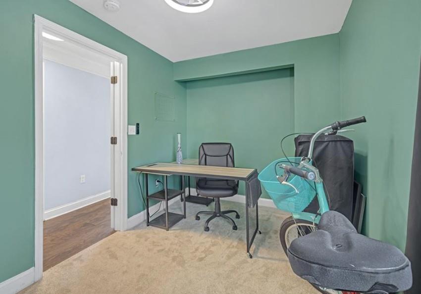 1146 Sims Street Southwest Atlanta, GA 30310 - Photo 15 of 20 a workspace with furniture and a wooden floor