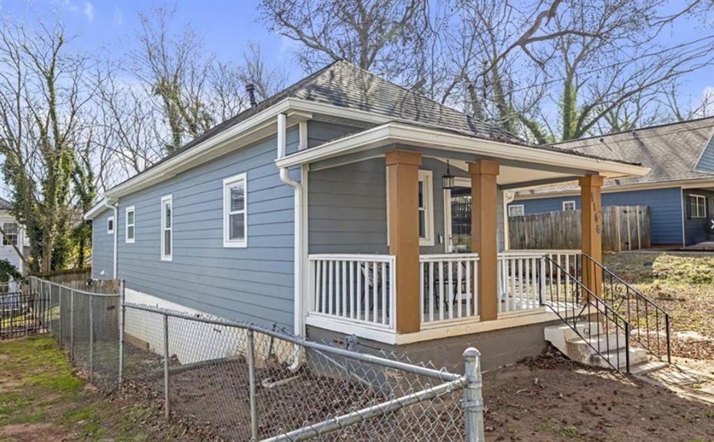 1146 Sims Street Southwest Atlanta, GA 30310 - Photo 2 of 20 a front view of a house with garden