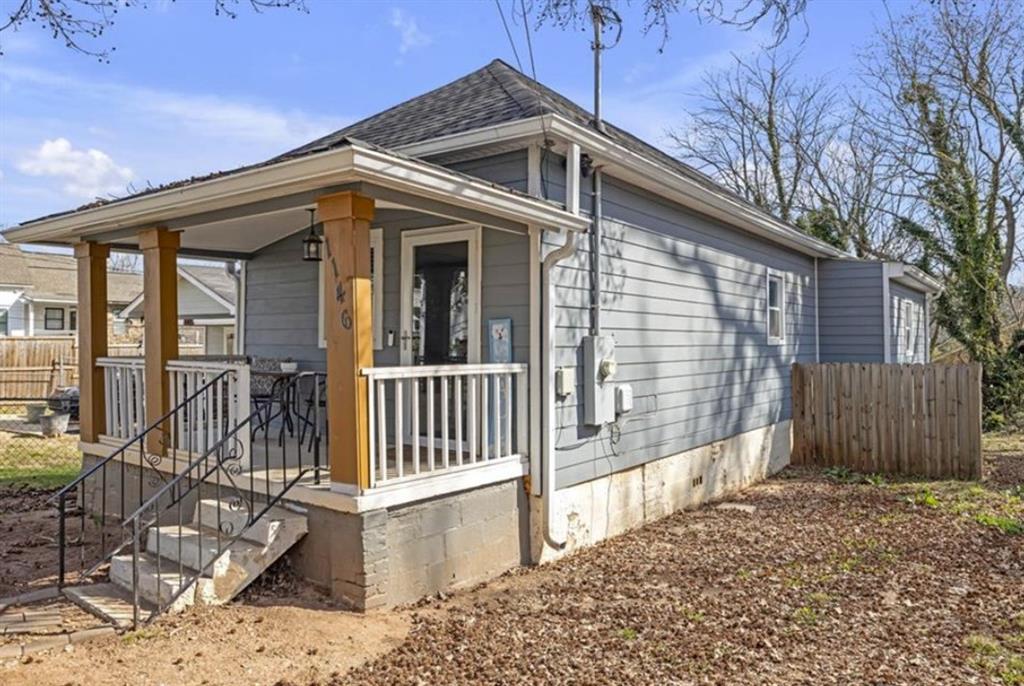 1146 Sims Street Southwest Atlanta, GA 30310 - Photo 3 of 20 a front view of a house with balcony