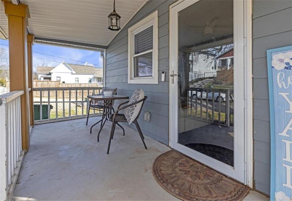 1146 Sims Street Southwest Atlanta, GA 30310 - Photo 4 of 20 a view of a porch with a table and chairs