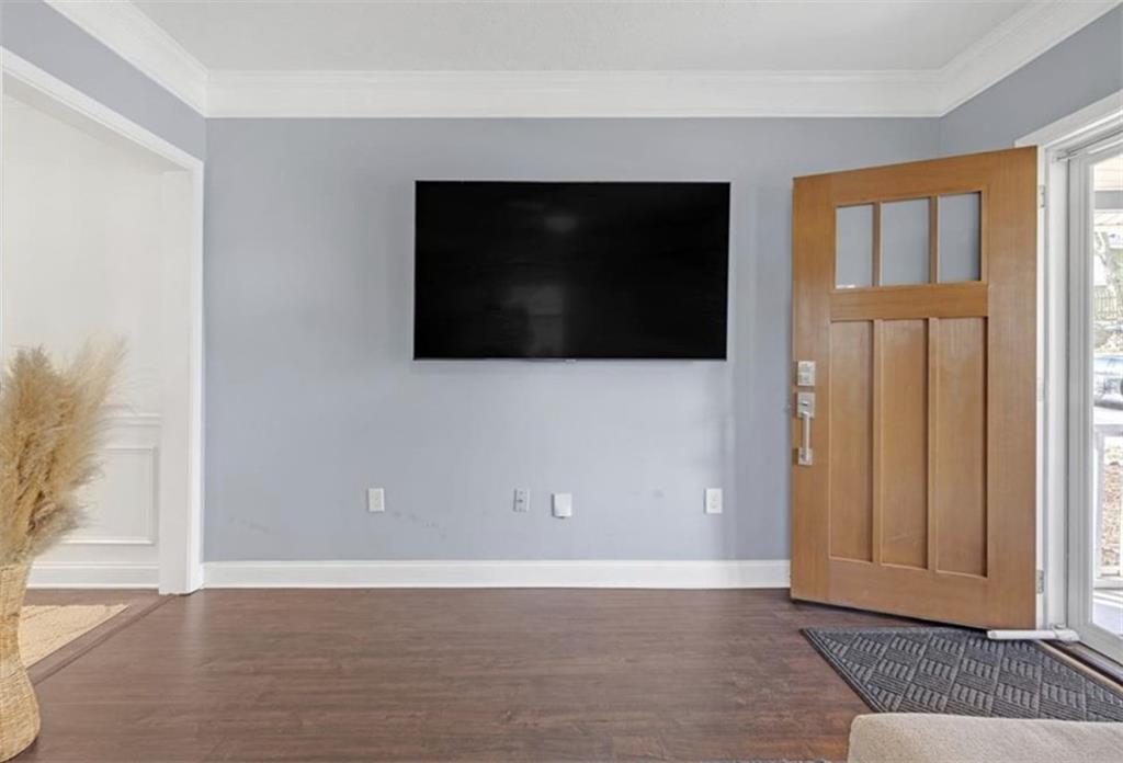 1146 Sims Street Southwest Atlanta, GA 30310 - Photo 6 of 20 a view of a livingroom with an empty space & wooden floor and windows