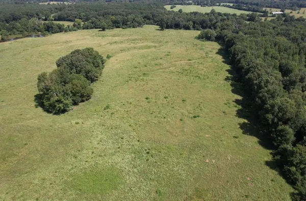 a view of a field with an outdoor space